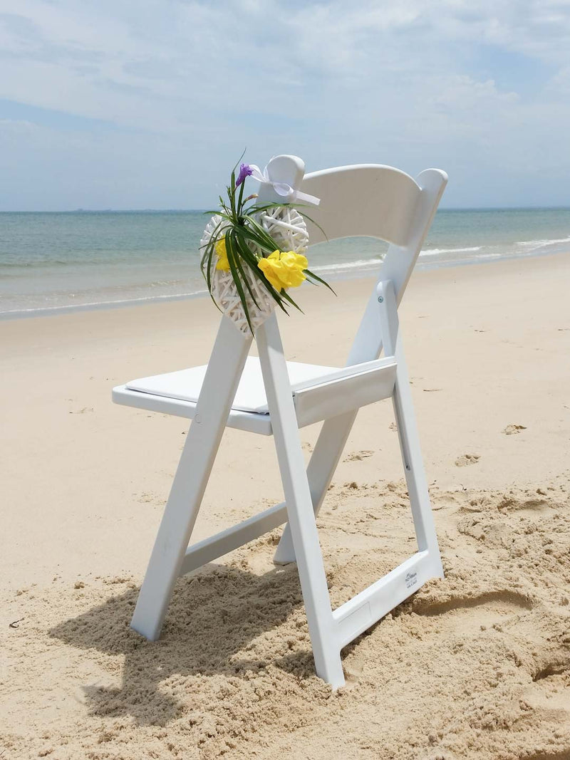 A folding chair set outdoors, perfect for home, backyard, or garden relaxation.