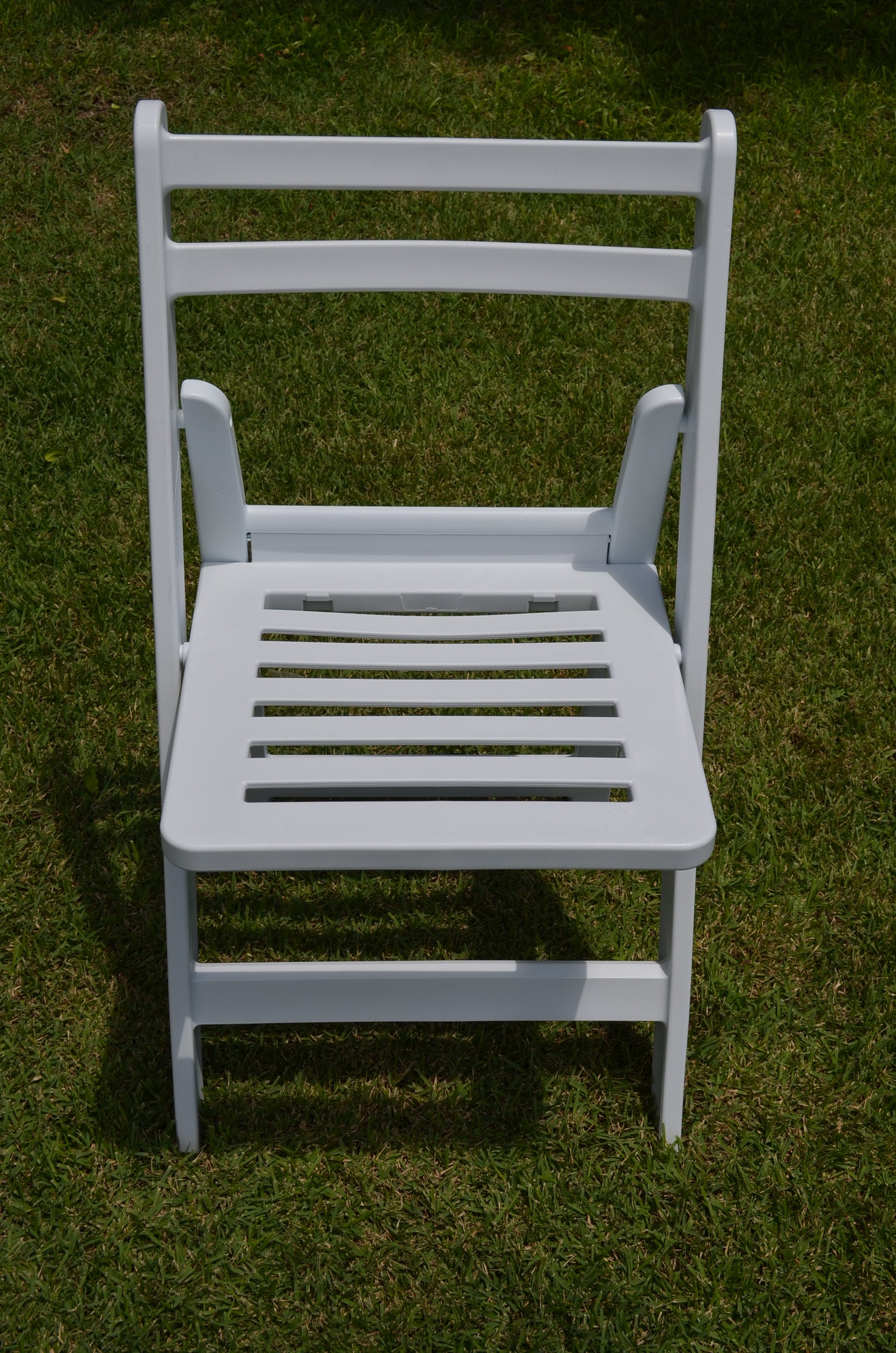 White Americana resin folding chair front view