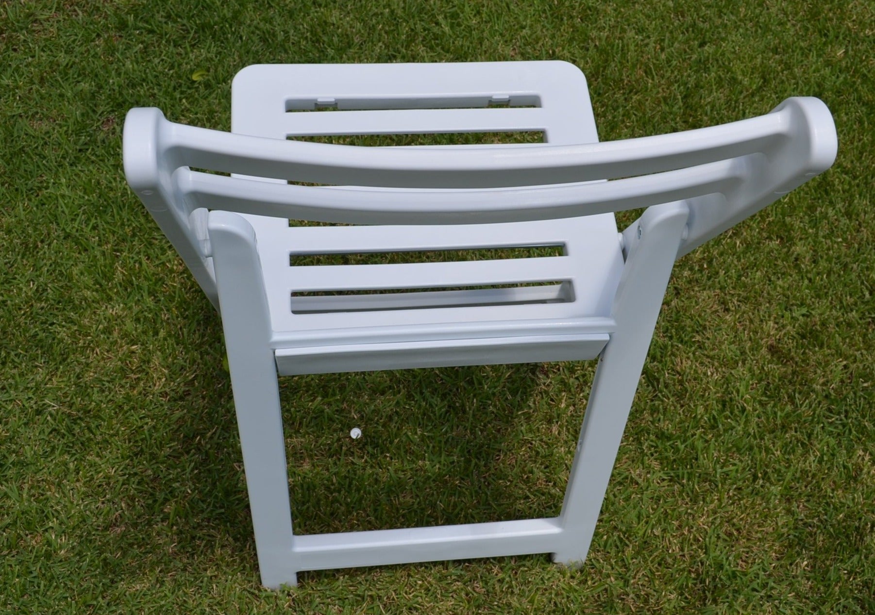 Back view of white Americana folding chair