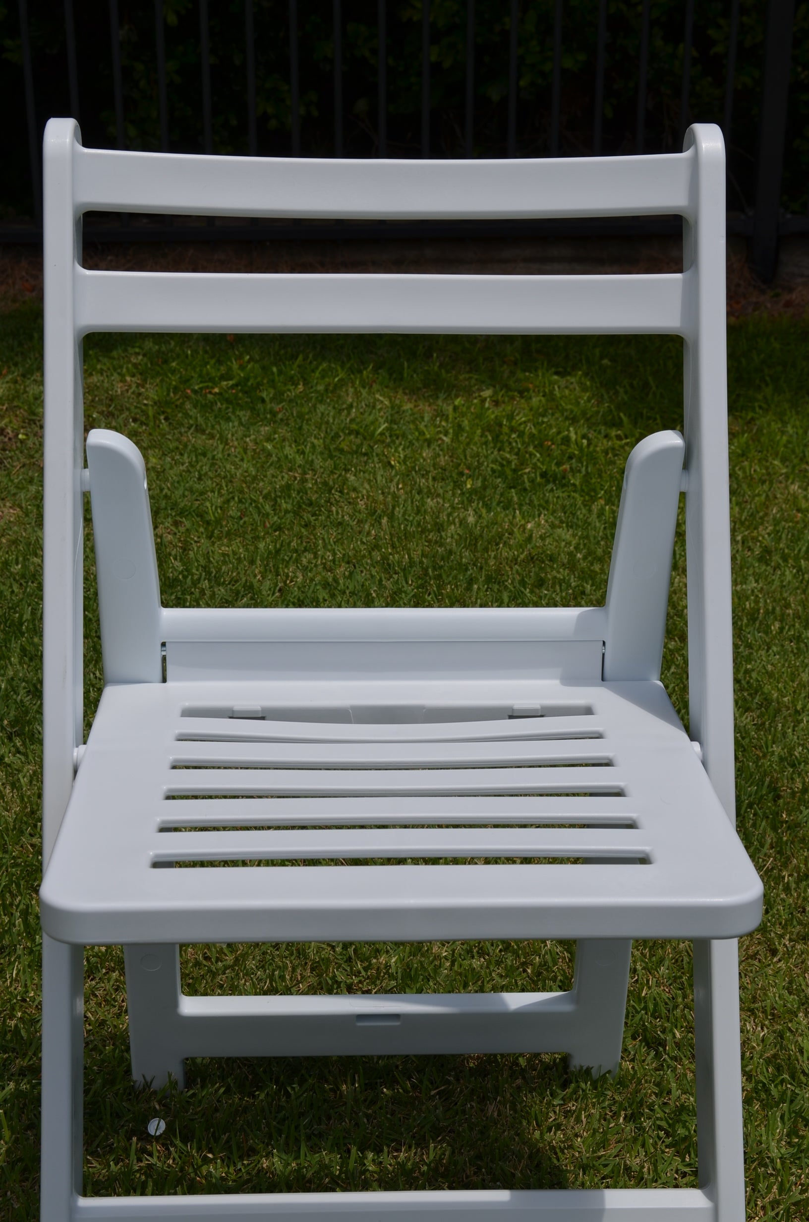 Front view of white Americana folding chair