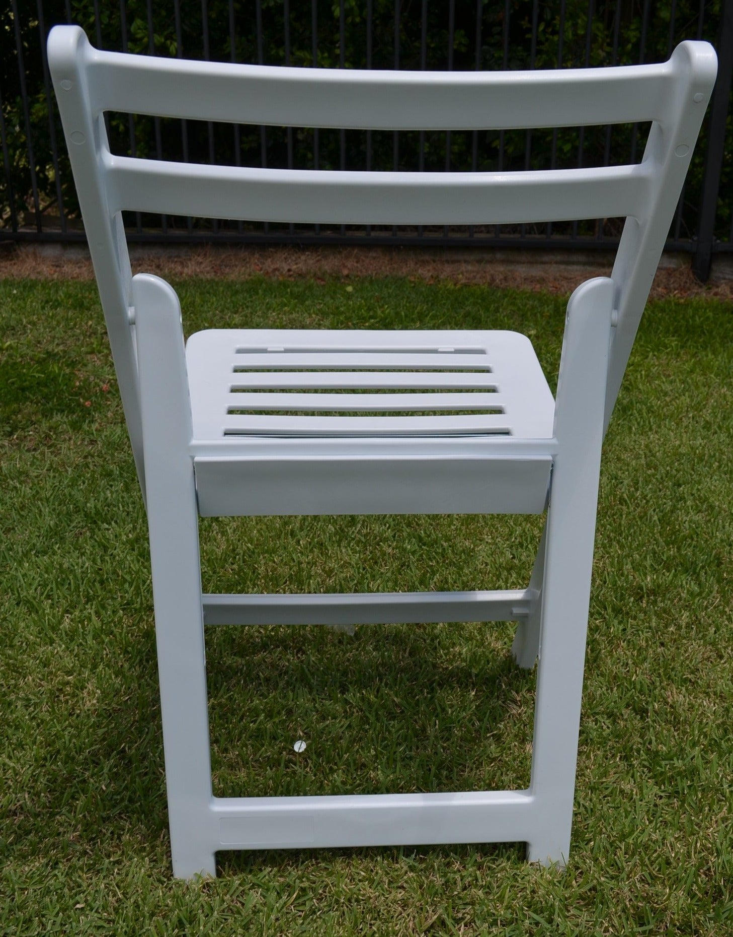 Rear view of white Americana folding chair